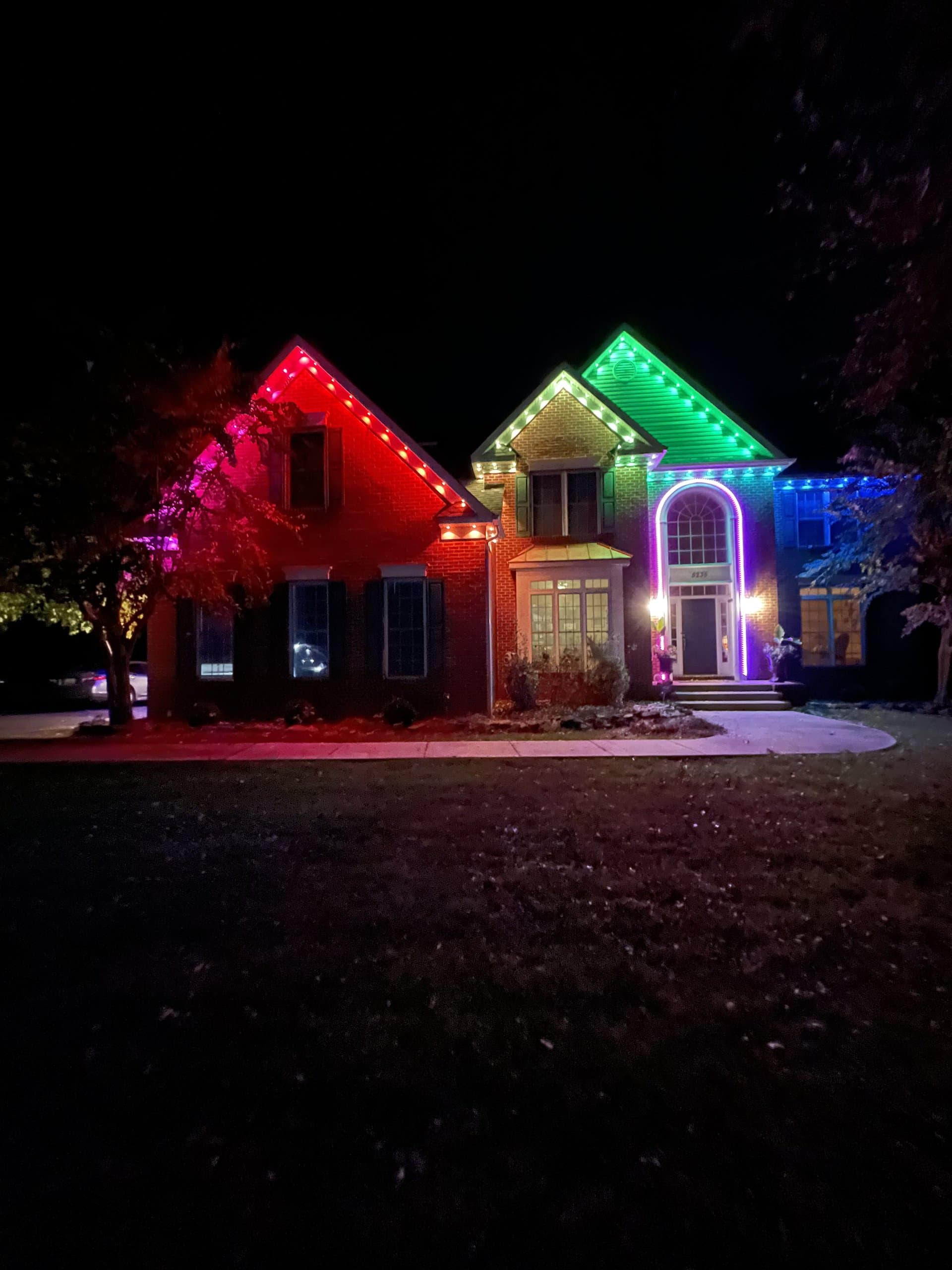 LED roofline installation at night
